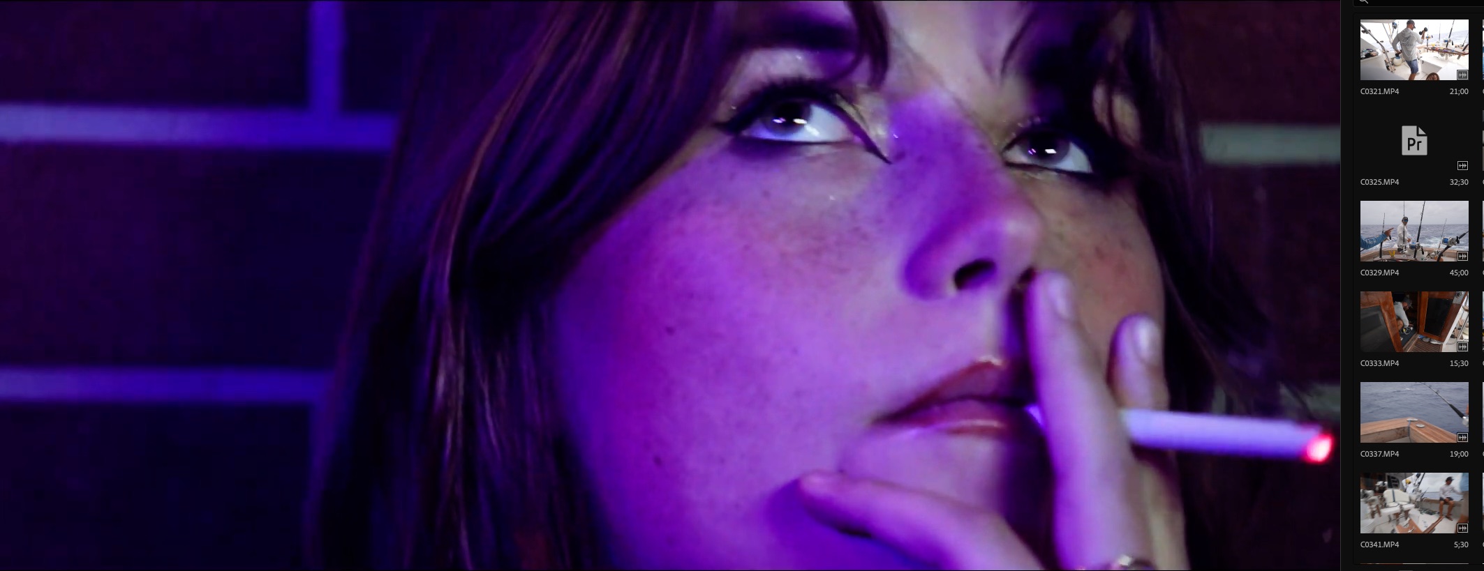 A woman holding a glass at a dimly lit table in If I Could Take Your Face, I Would